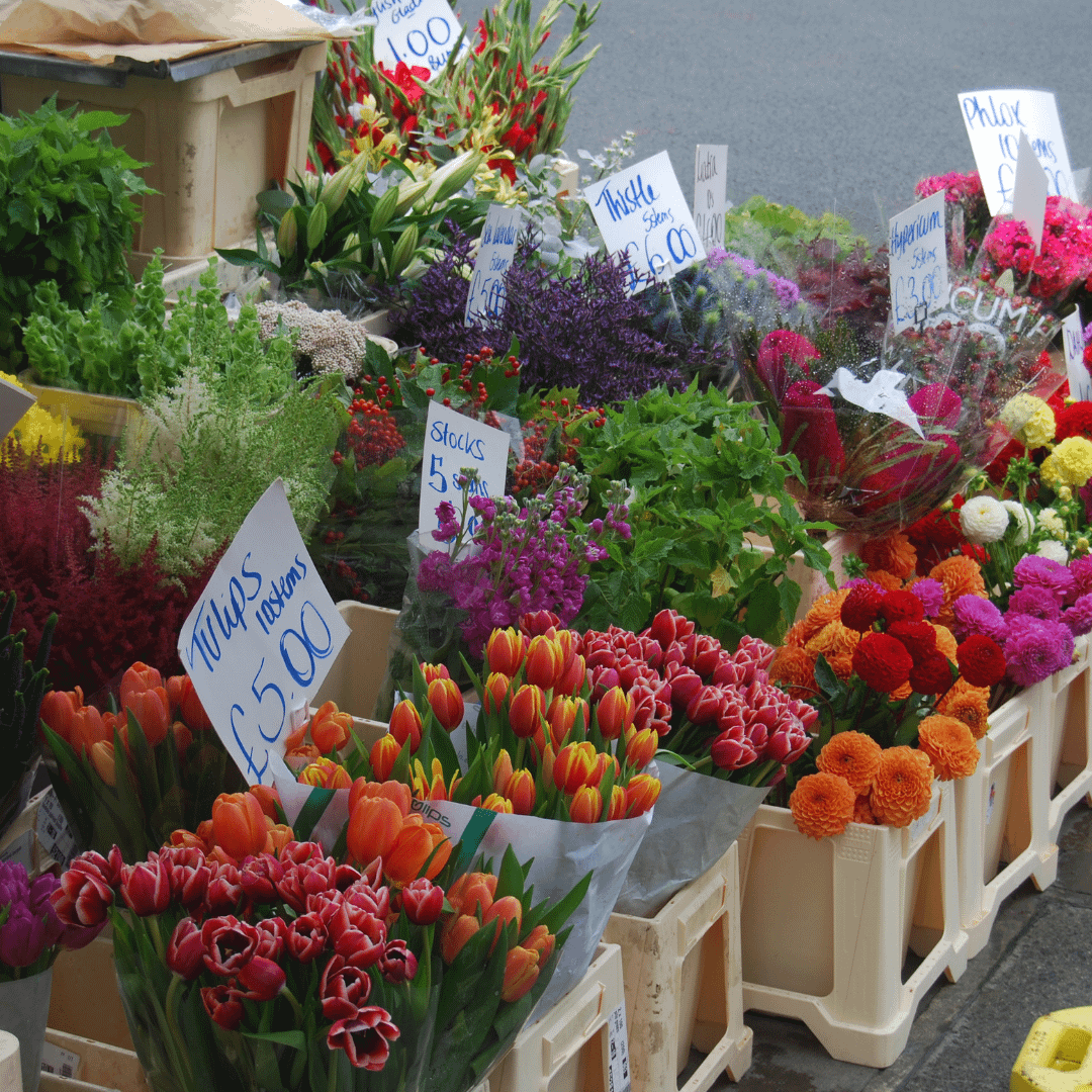 A stand of non sustainably sourced street flowers are pictured. 