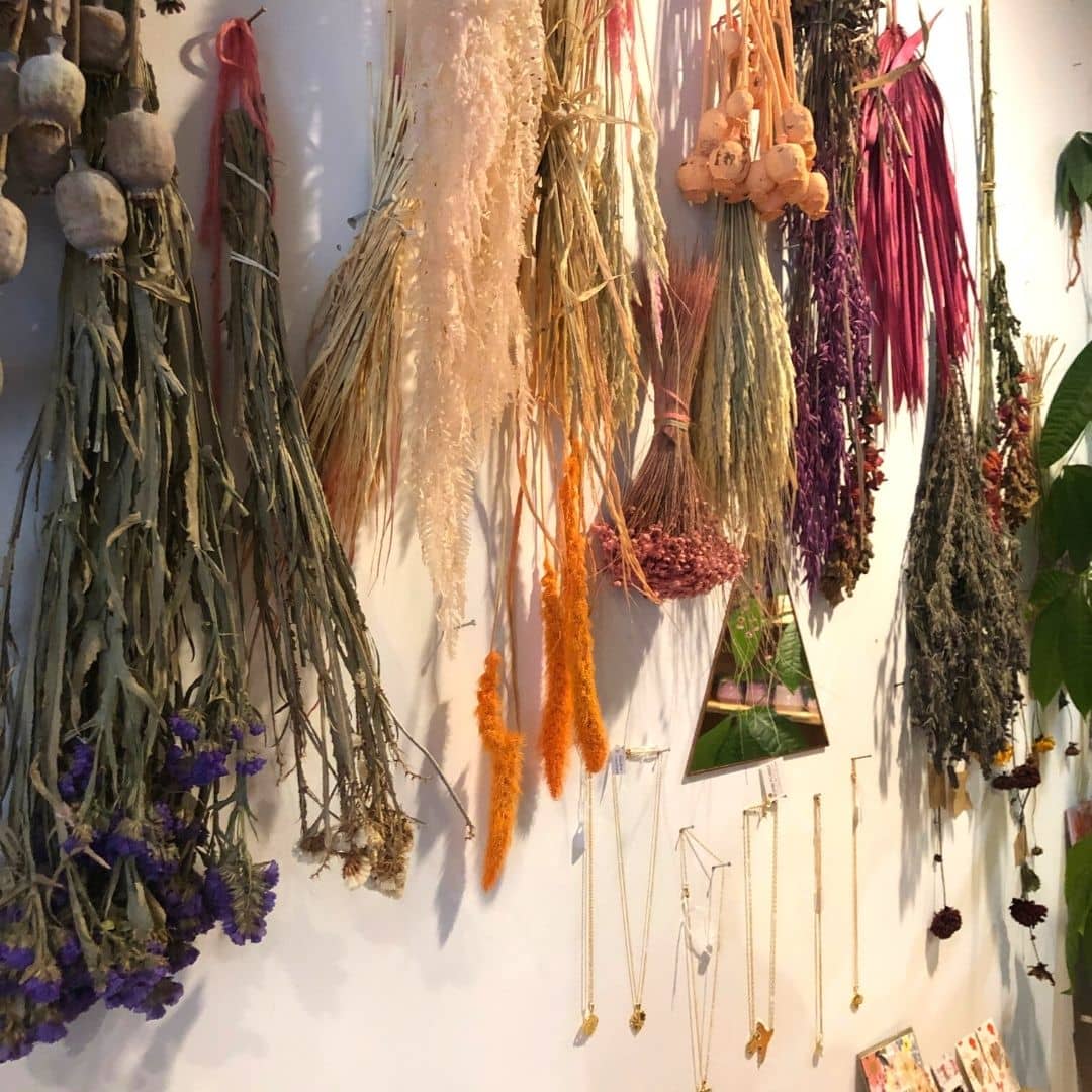 Moonko provides a great option for sustainable flower buying- pictured are some beautiful dried flowers hanging from the shop wall. 
